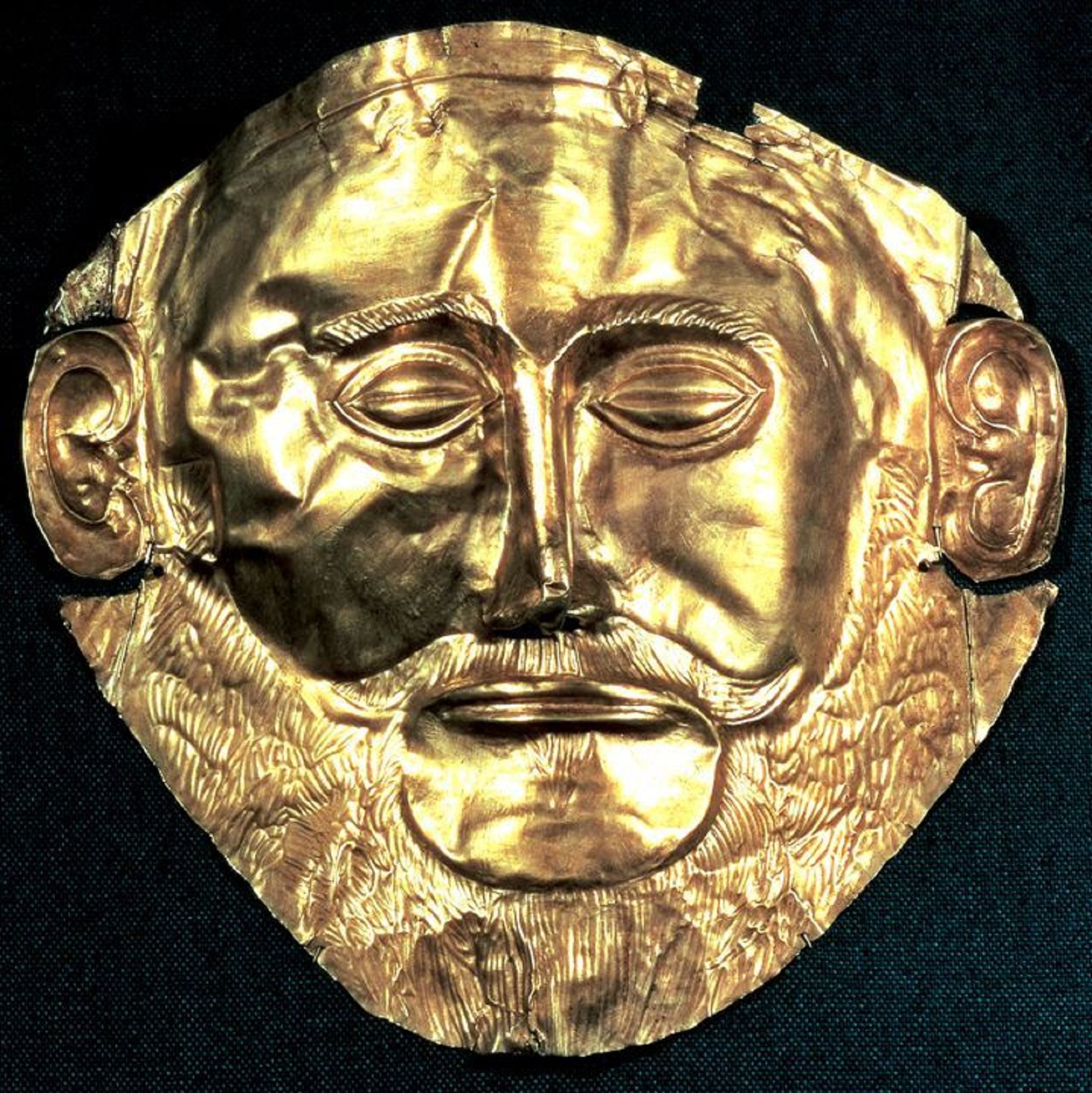 Сын агамемнона 5 букв. Погребальная маска Агамемнона. Золотая маска Агамемнона. Посмертная маска царя Агамемнона. Маска Агамемнона 16 до н.э.
